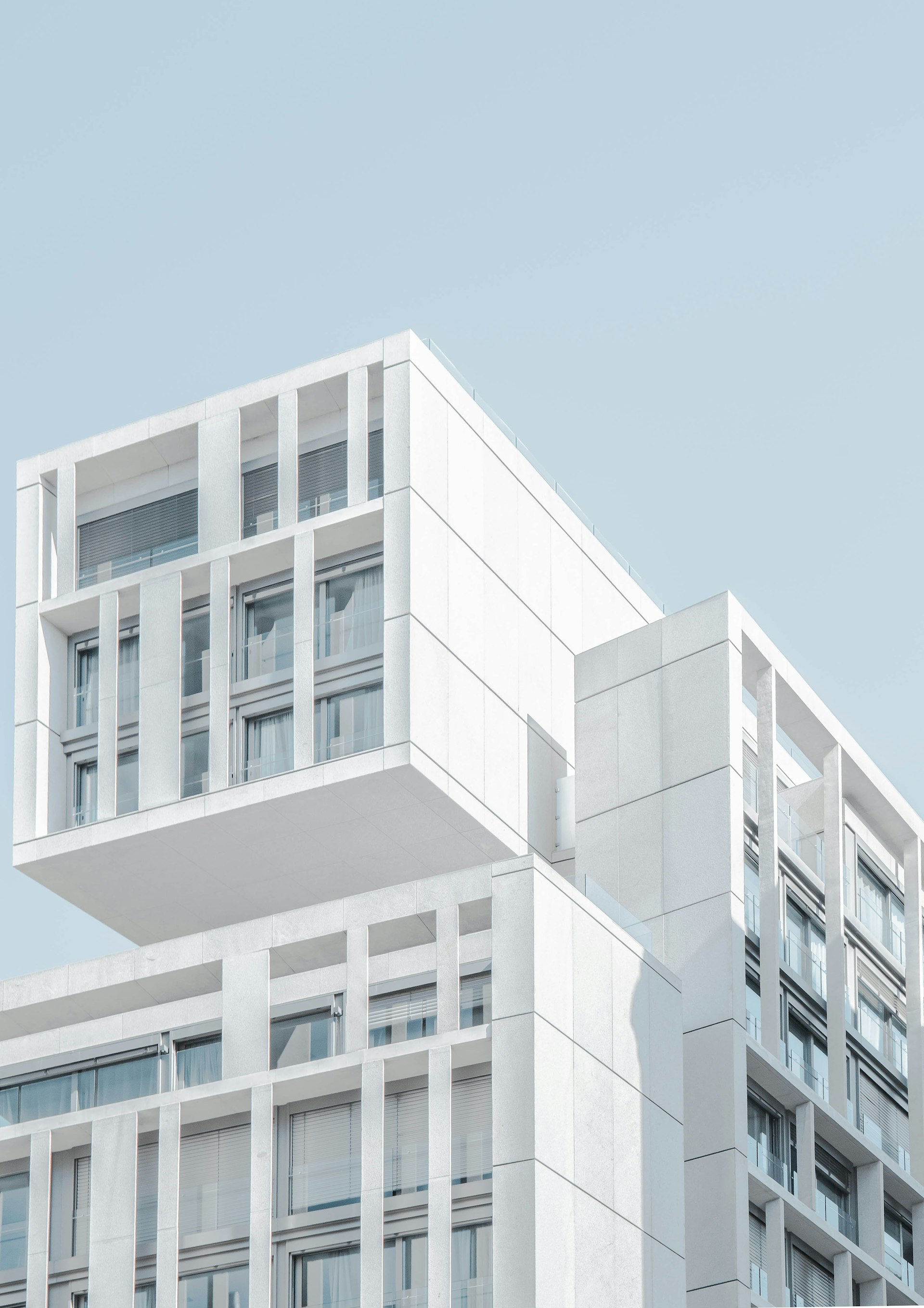 Structural detail of a modern building, evoking private-market architecture